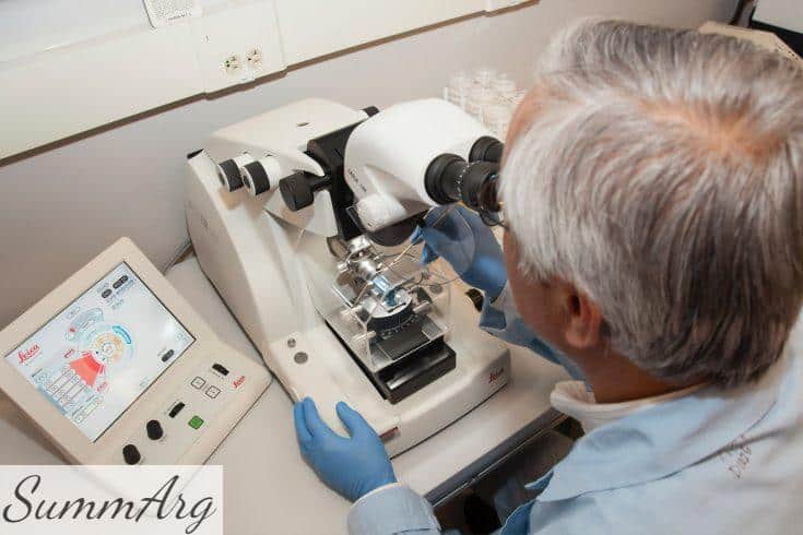 man in white shirt using white sewing machine