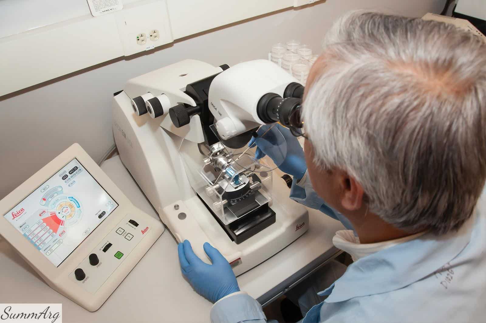 man in white shirt using white sewing machine