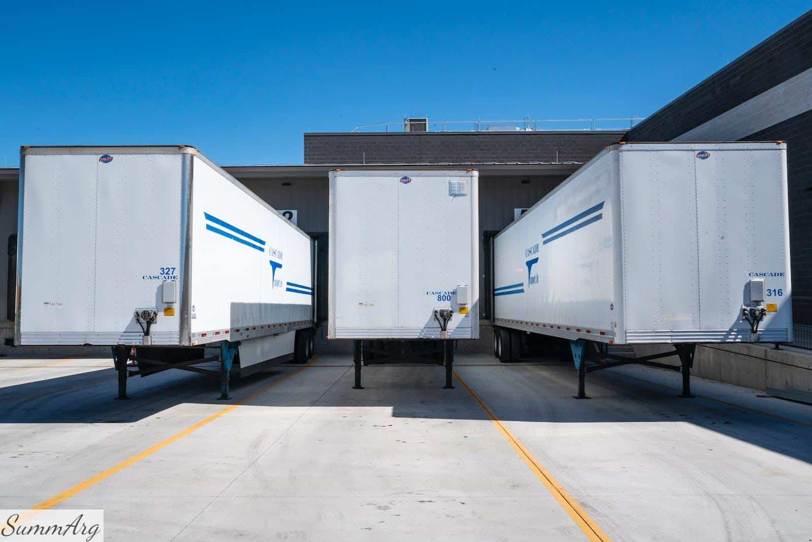 Three White Enclosed Trailers