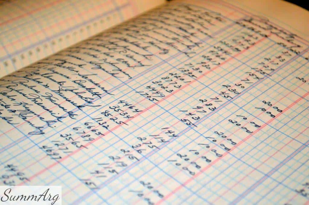 Close-up of a vintage handwritten ledger detailing financial records and accounts.